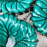 Salad bowl and small bowls in leaf-shaped slipware