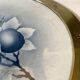 Art Nouveau plate in earthenware with a brass frame