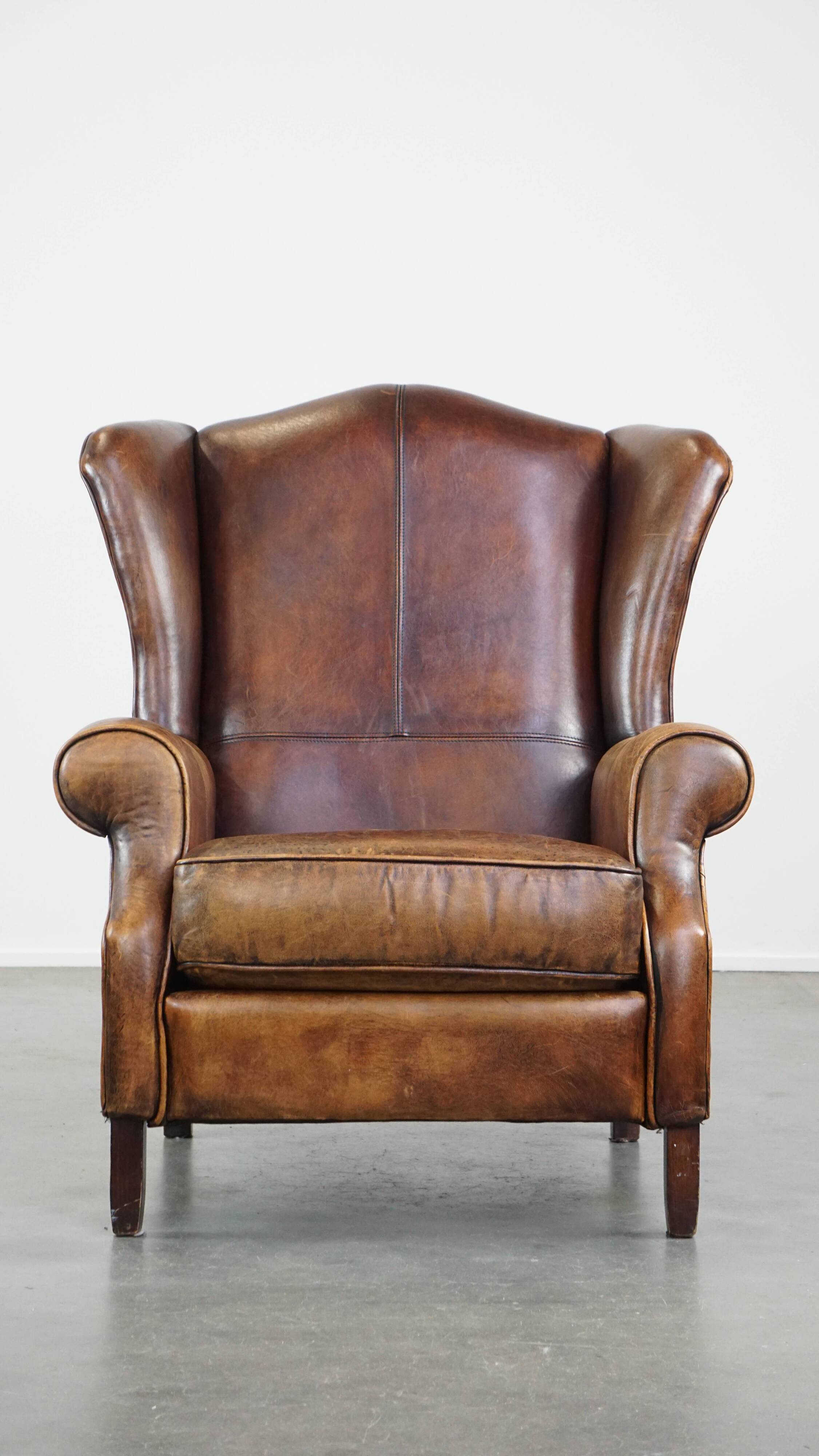 Fauteuil à oreilles en cuir de mouton