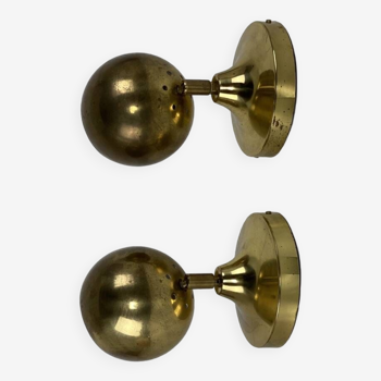 Pair of spherical Guzzini brass wall lights, 1970