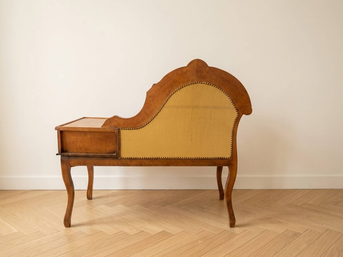 Vintage telephone bench in Louis XV style made of wood and yellow fabric.