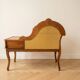 Vintage telephone bench in Louis XV style made of wood and yellow fabric.
