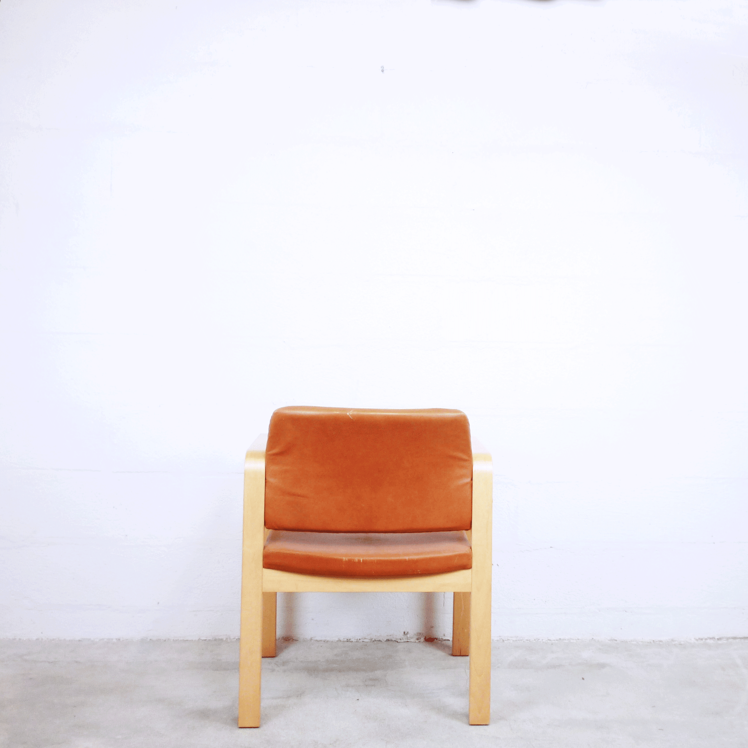 Fauteuil en cuir et en bois 1990