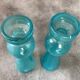 Pair of vintage candlesticks in molded glass turquoise blue 20 cm
