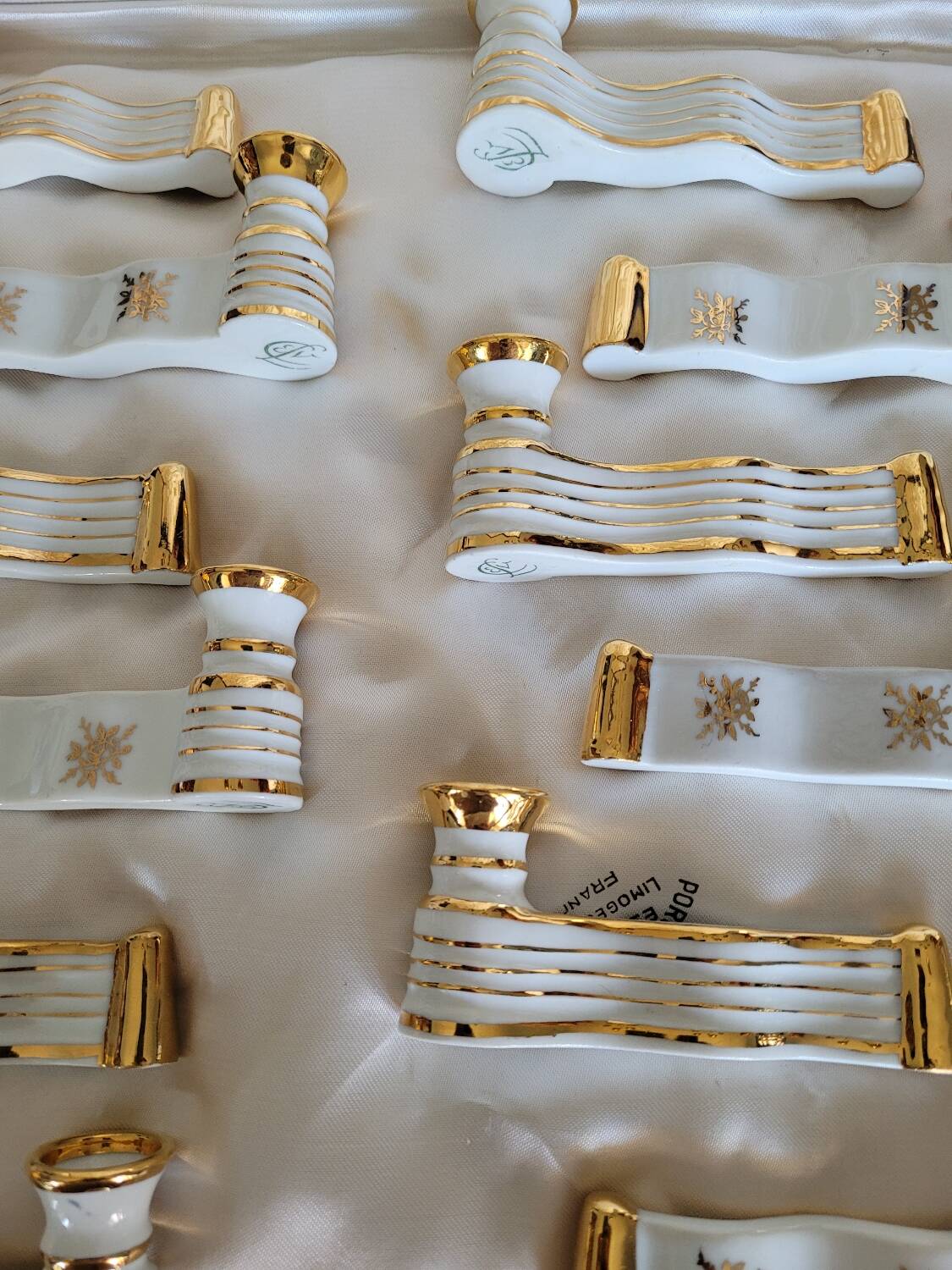 12 Limoges art porcelain knife rests in their case