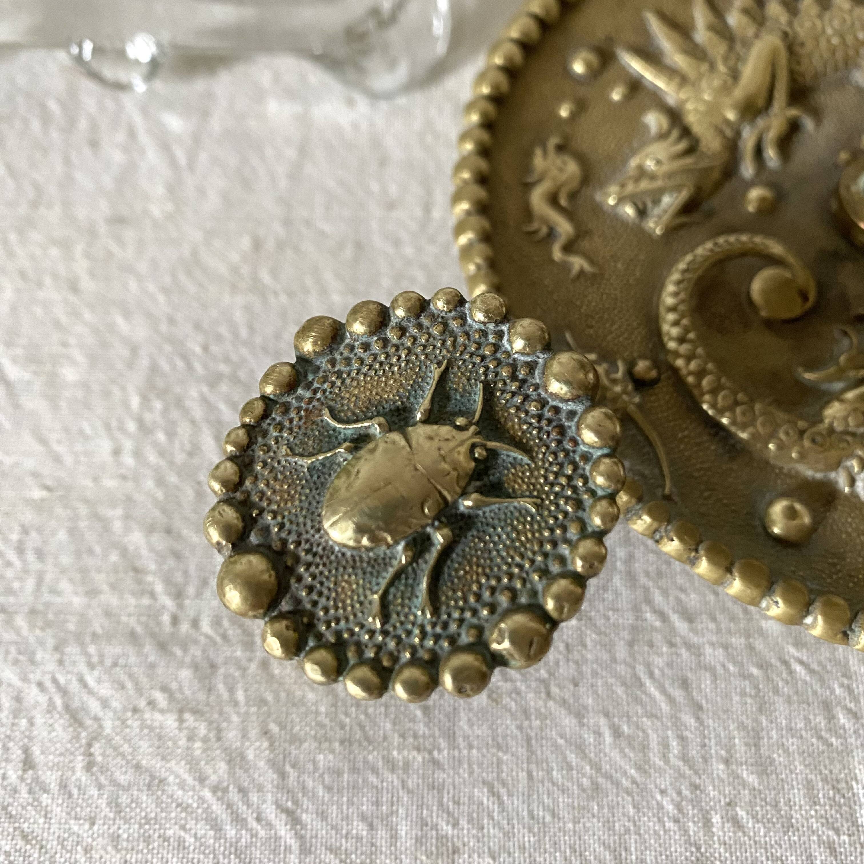 Brass thumb candle holder, scarab