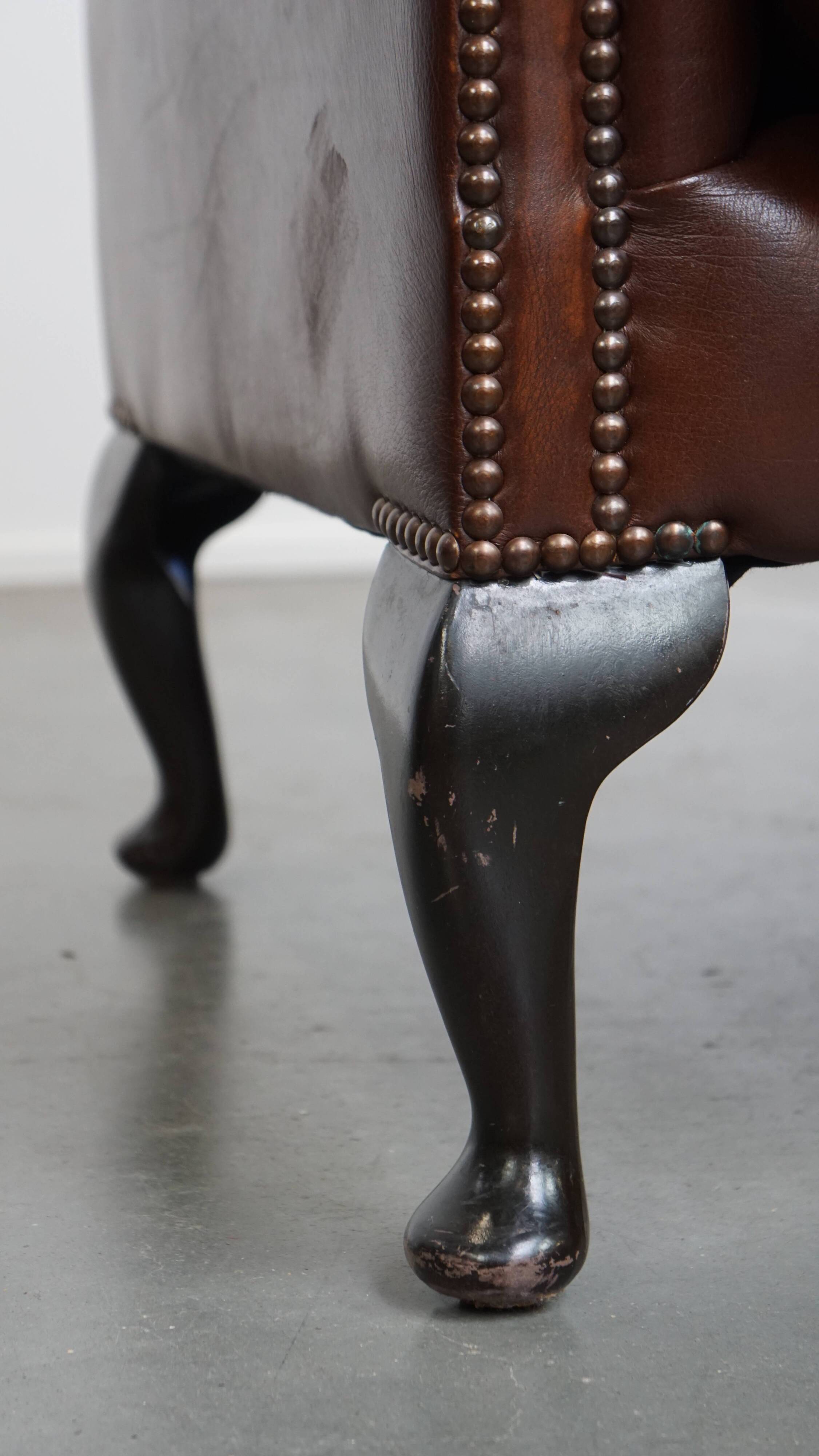 Chesterfield wing chair in dark brown English cowhide