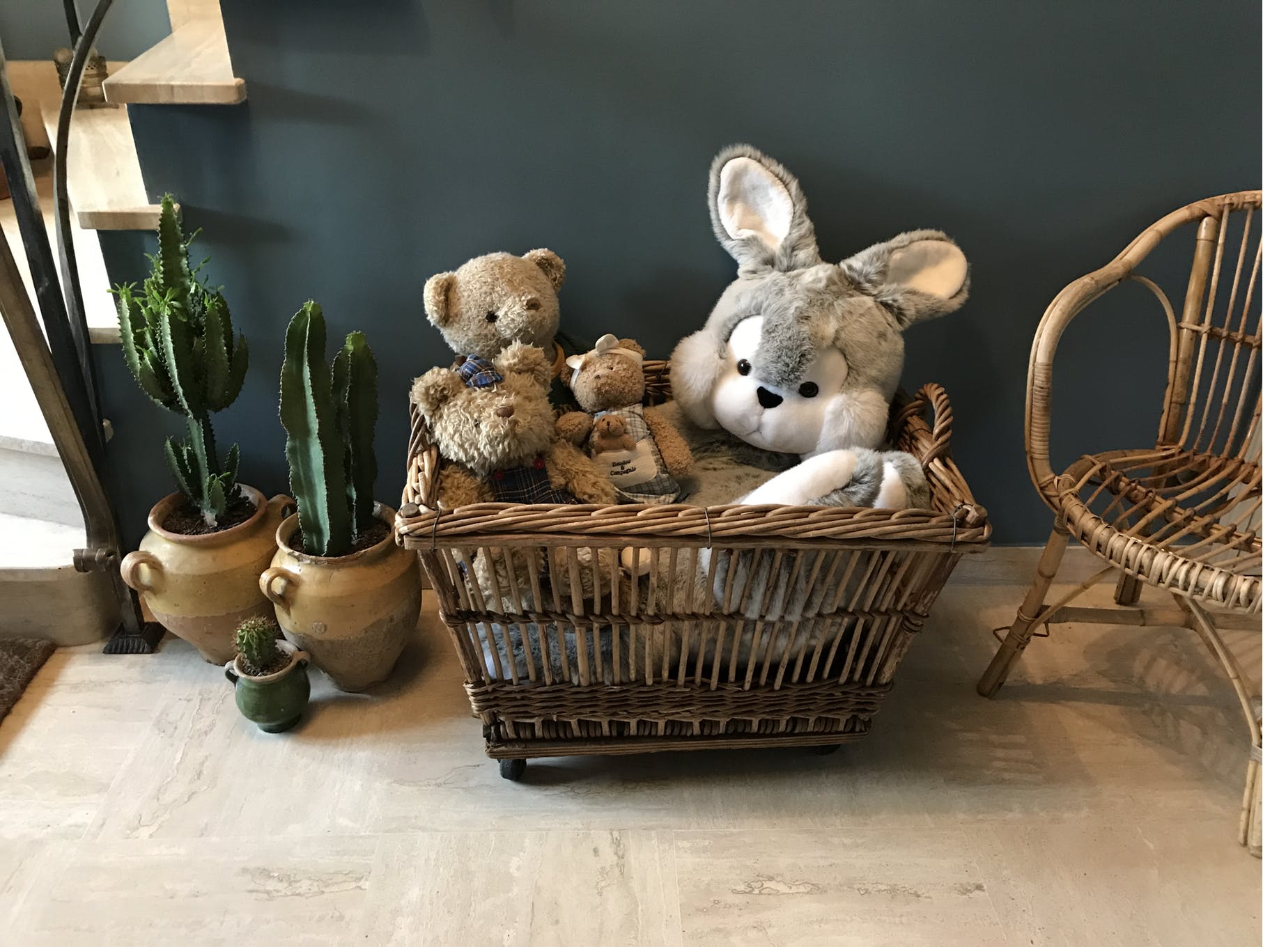 Rattan laundry basket on vintage wheels