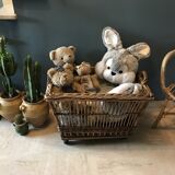 Rattan laundry basket on vintage wheels