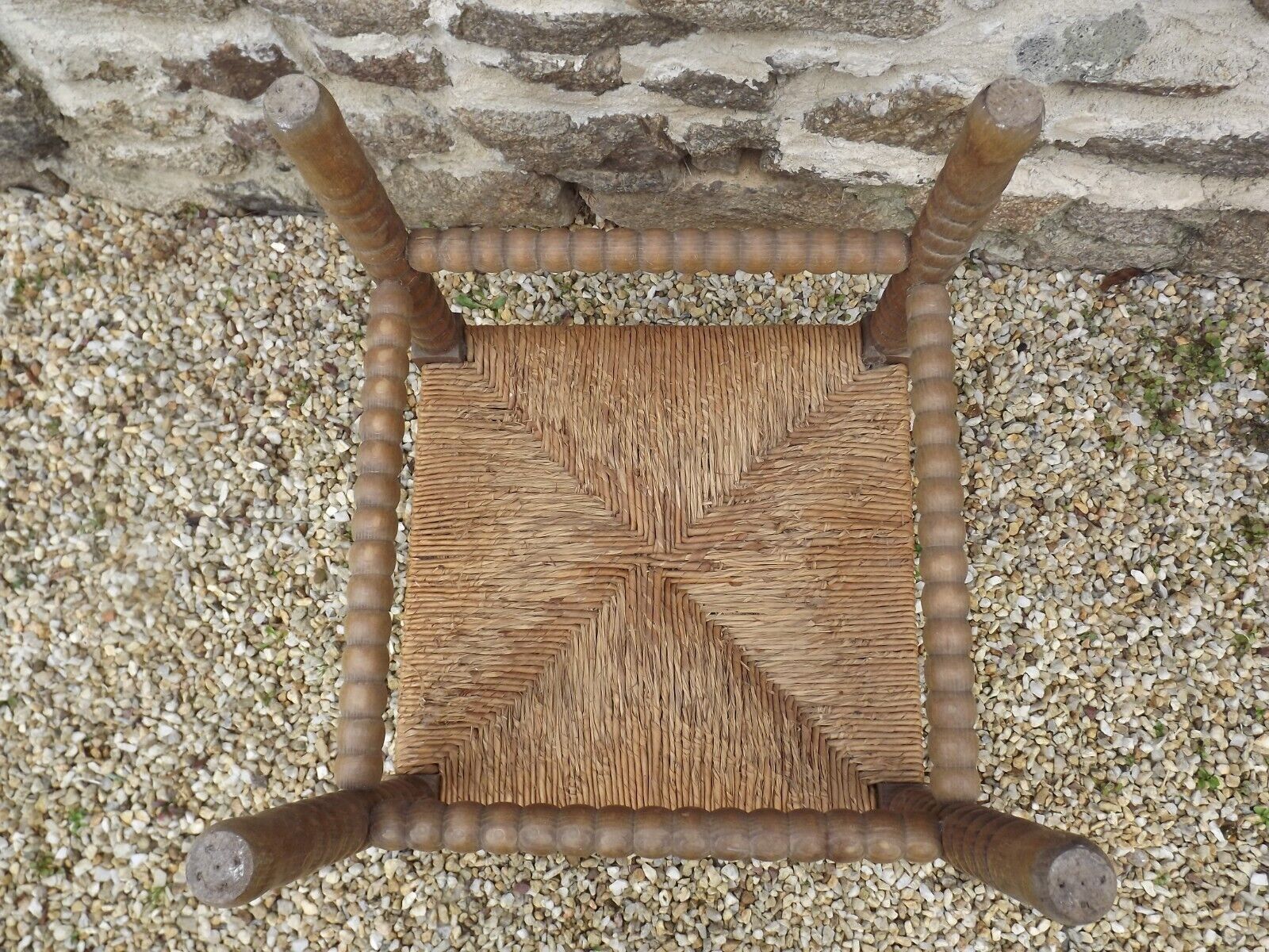 French antique turned wooden bobbin chair with rush seat
