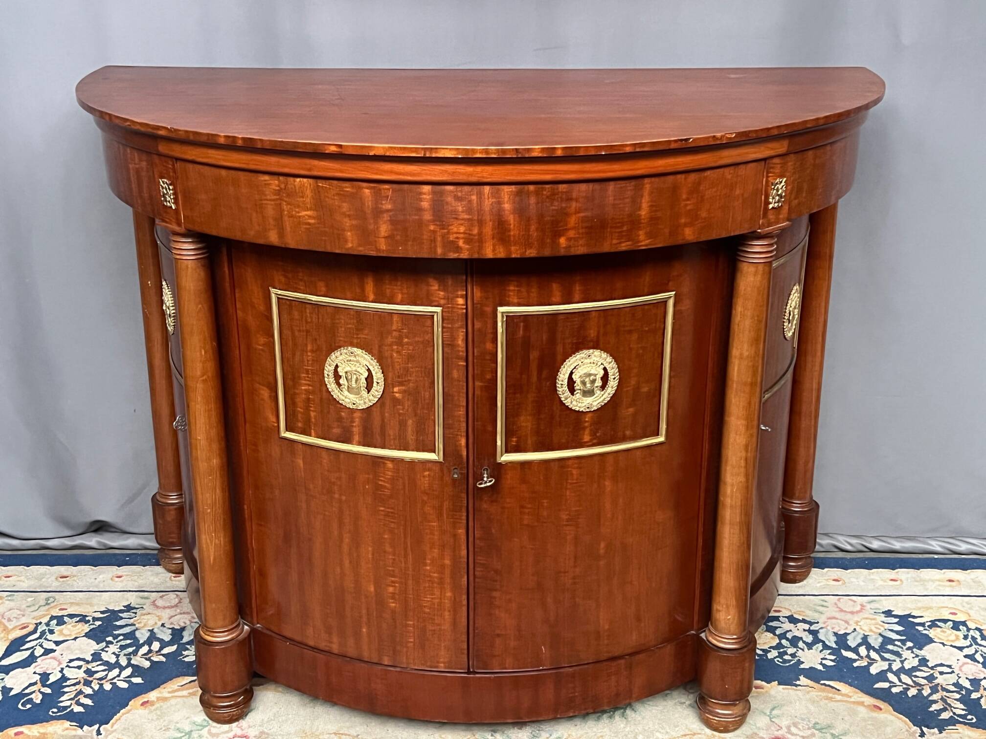 Empire style sideboard. Mahogany. Gilded bronze decoration.