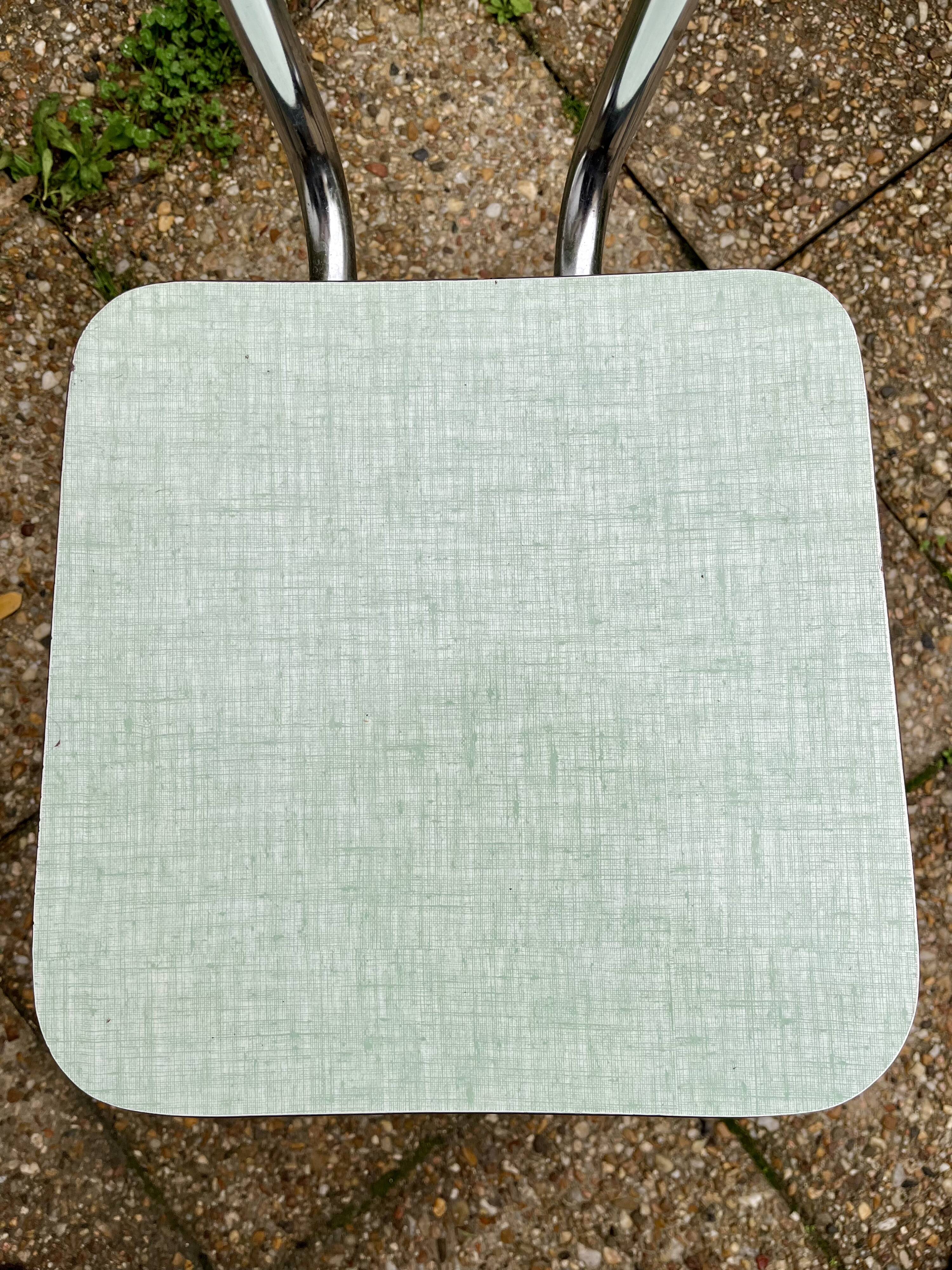 Green-blue Formica chair