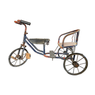 Vintage two-seater antique tricycle