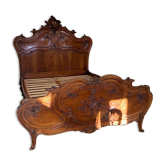 Superb Louis XV Provençal bed in richly carved and engraved walnut.
