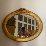 Oval mirror in gilded wood with knot, 32x37 cm