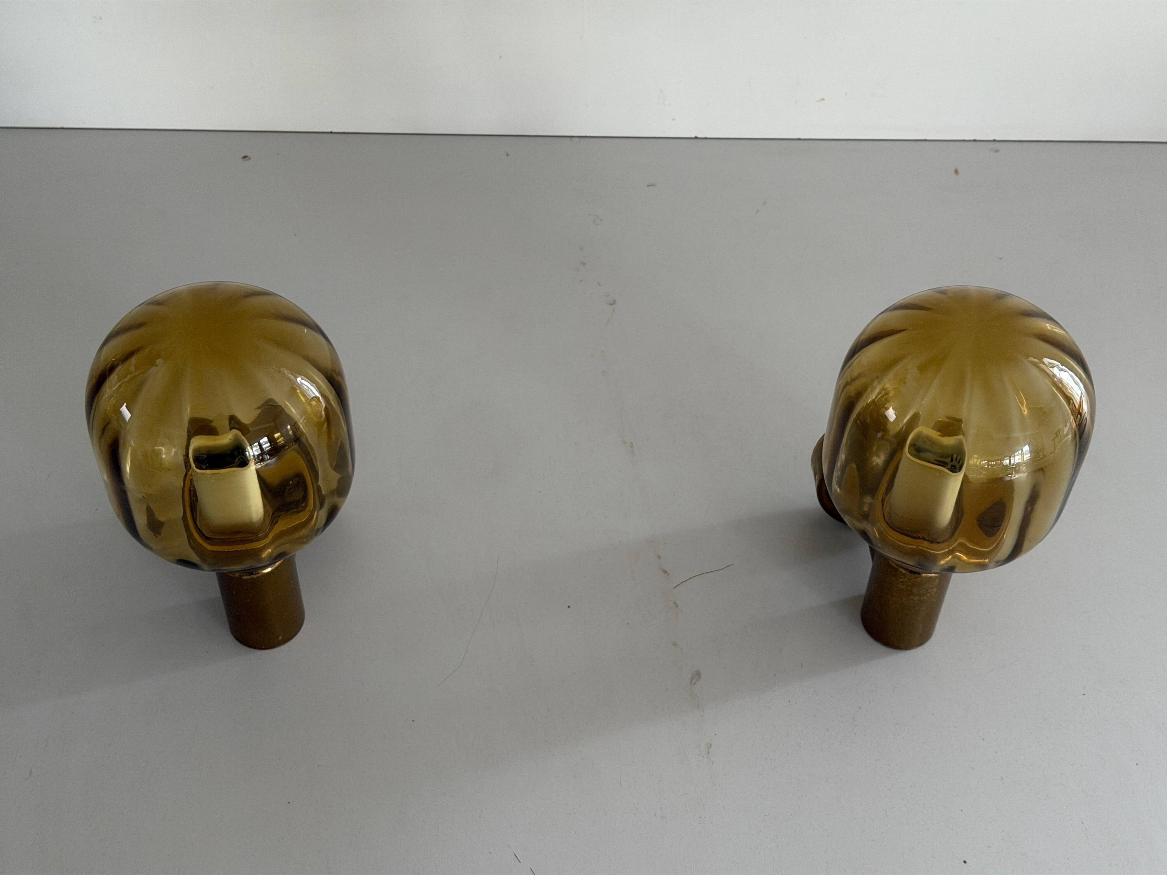 Pair of yellow glass and brass wall lights from the mid-century by N Leuchten, 1960s, Germany.