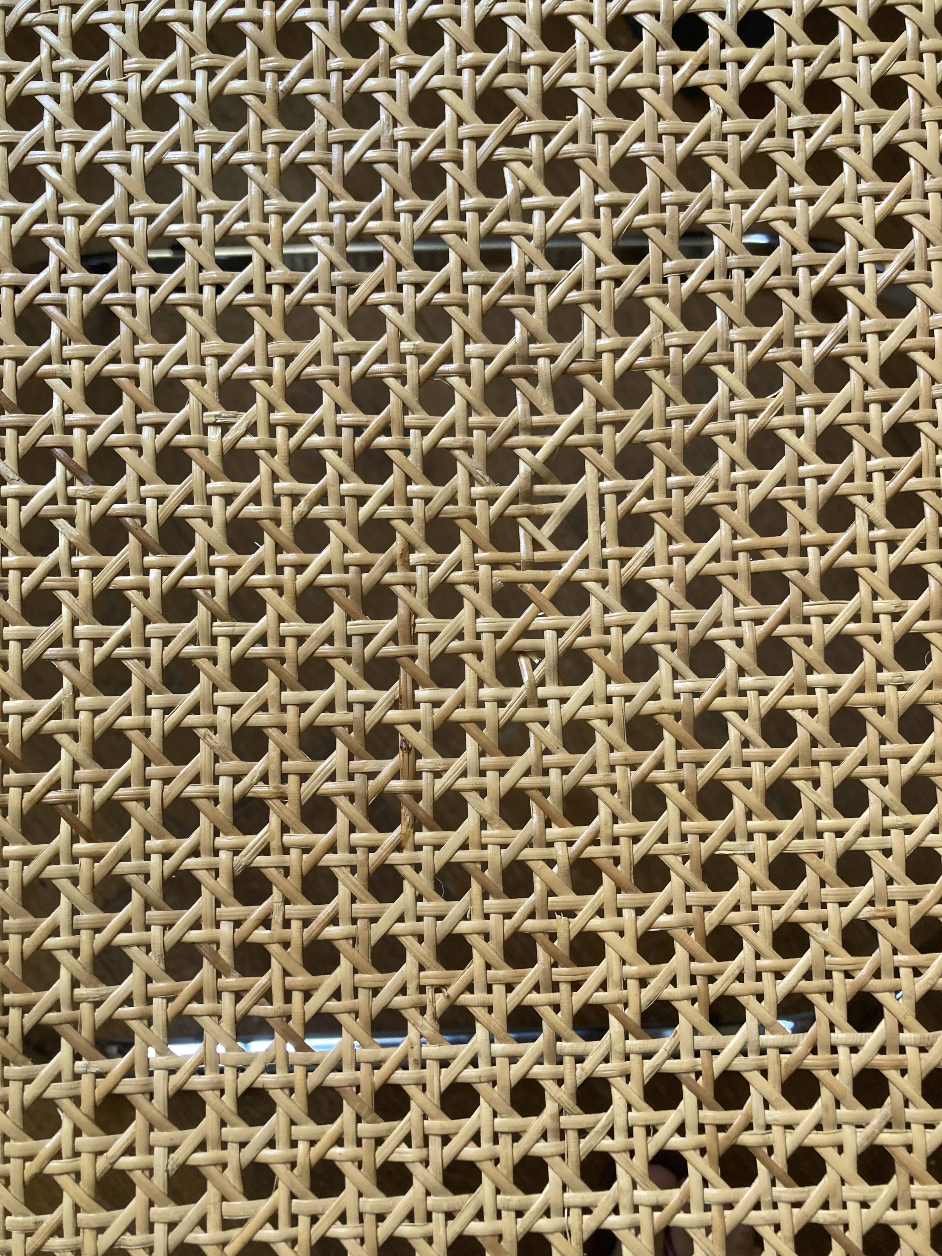 Plia chairs by Castelli in wood and cane.