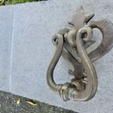 Impressive door knocker from the High Middle Ages in solid bronze.