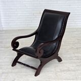 1970s, vintage armchair with footstool, black furniture leather.
