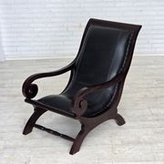 1970s, vintage armchair with footstool, black furniture leather.