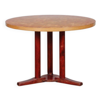 Round wooden dining table from the 1980s.