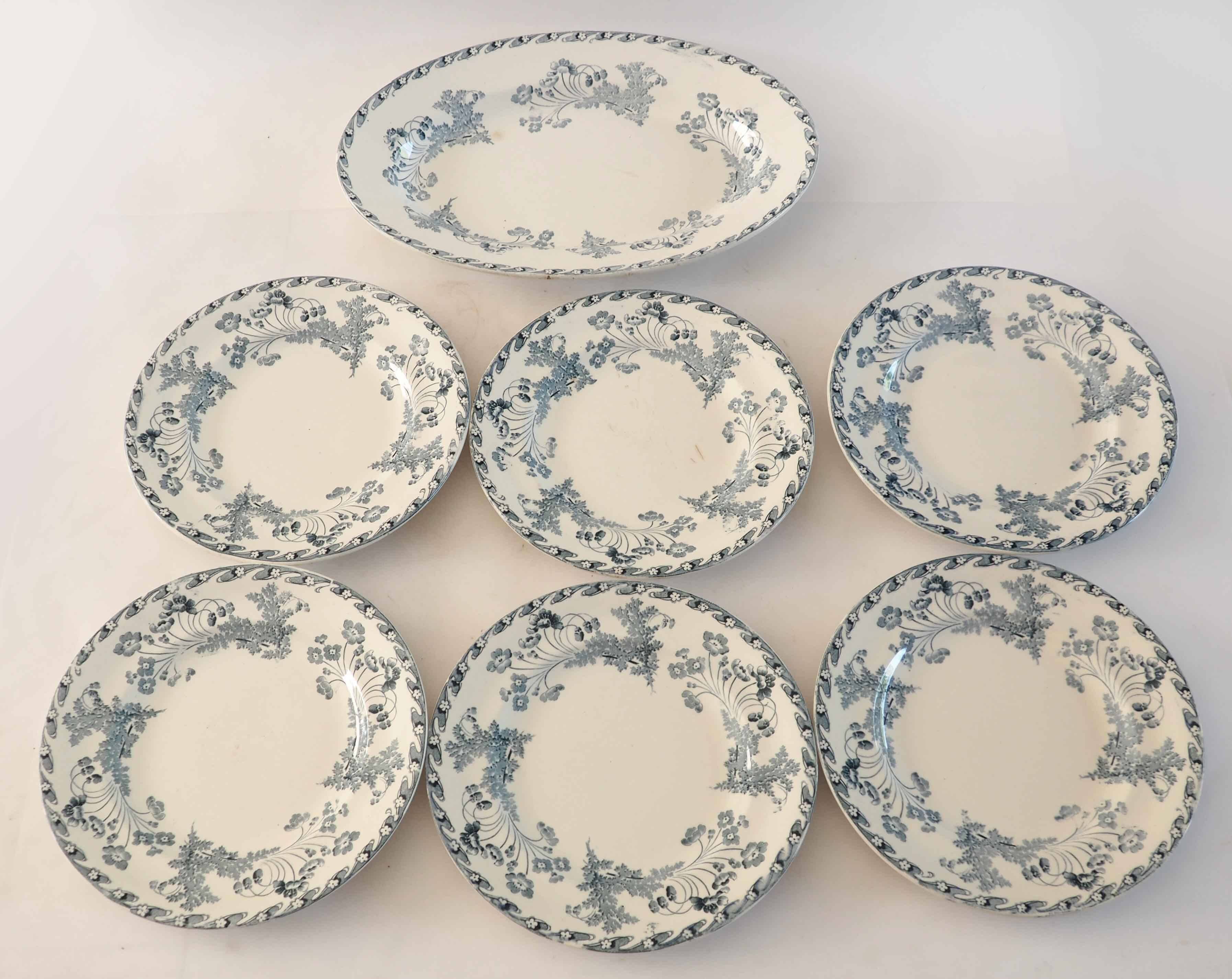 6 assiettes et 1 plat ovale en terre de fer
