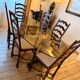 Large antique dining table in wrought iron and smoked glass,