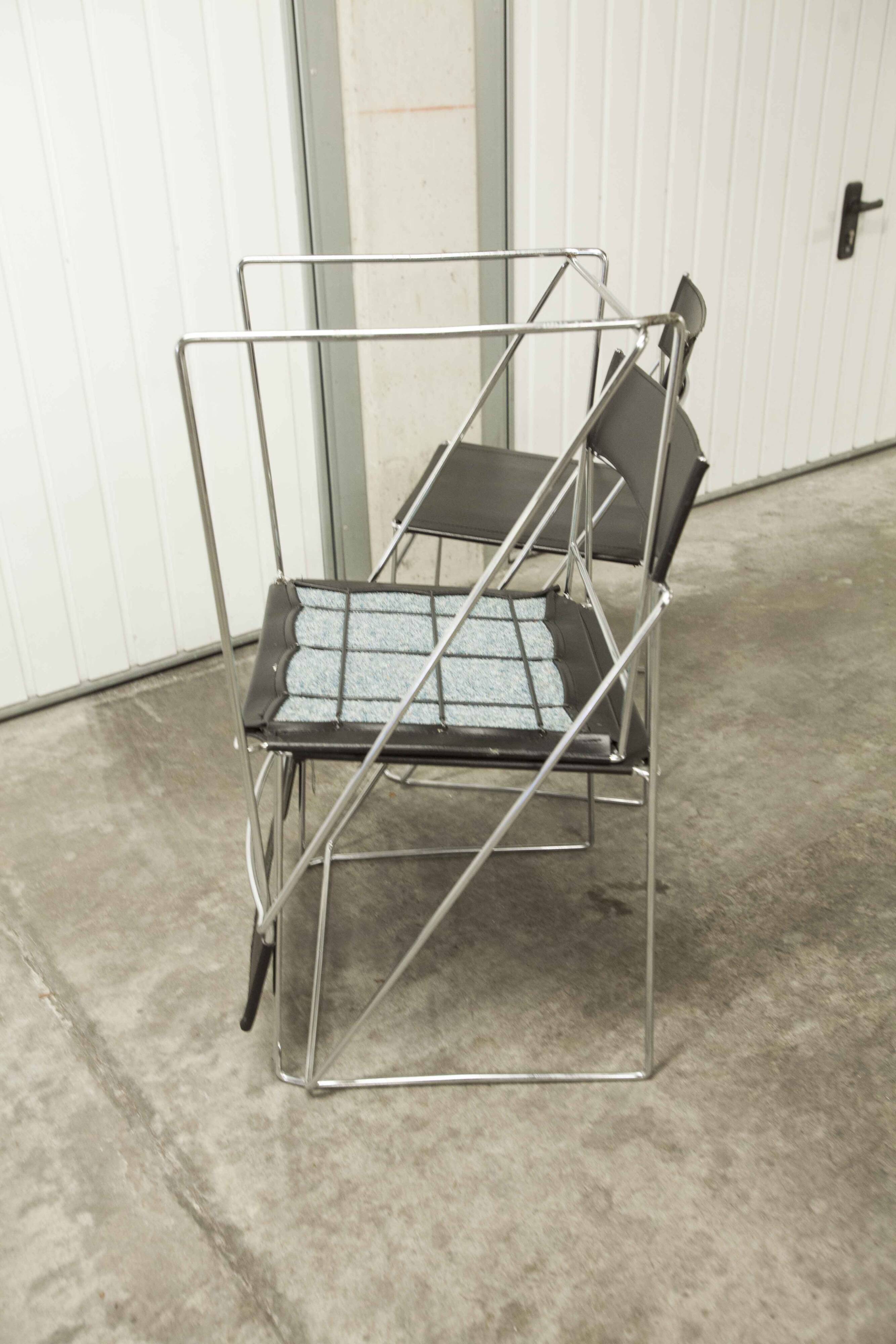 Set of 3 minimalist X line chairs by Niels Jorgen Haugesen.