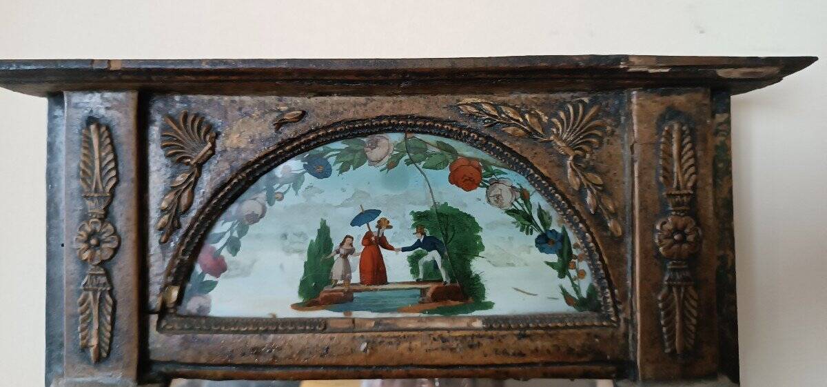 Small antique Empire mirror in gilded wood painted on glass