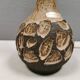 Small beautiful ceramic table lamp in earth colors.