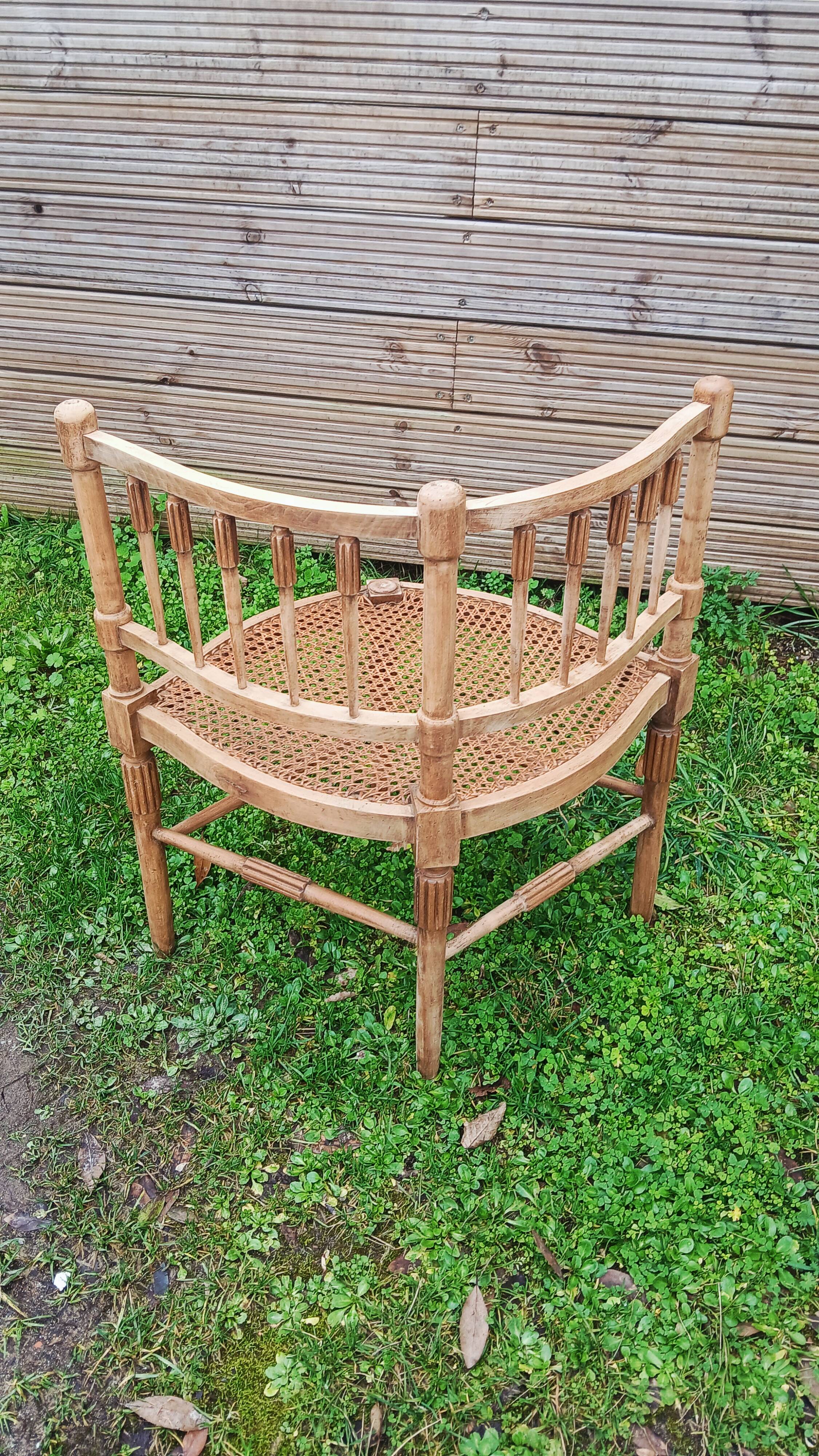 Corner chair in beech, caned seat from the early 20th century.