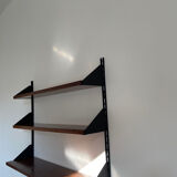 Shelves in rosewood and black lacquered metal from the 50s
