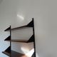 Shelves in rosewood and black lacquered metal from the 50s