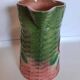 Slush pitcher. Pansy pattern on wicker basket background. Green and pink.