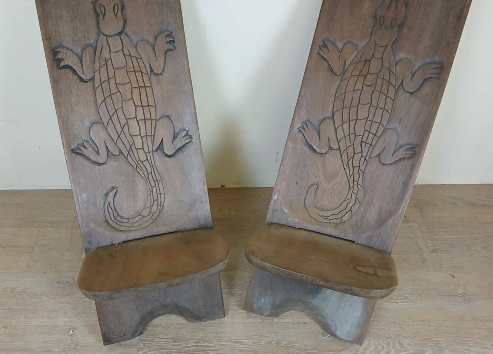 Central Africa circa 1950: pair of exotic wood chairs decorated with crocodile sculptures