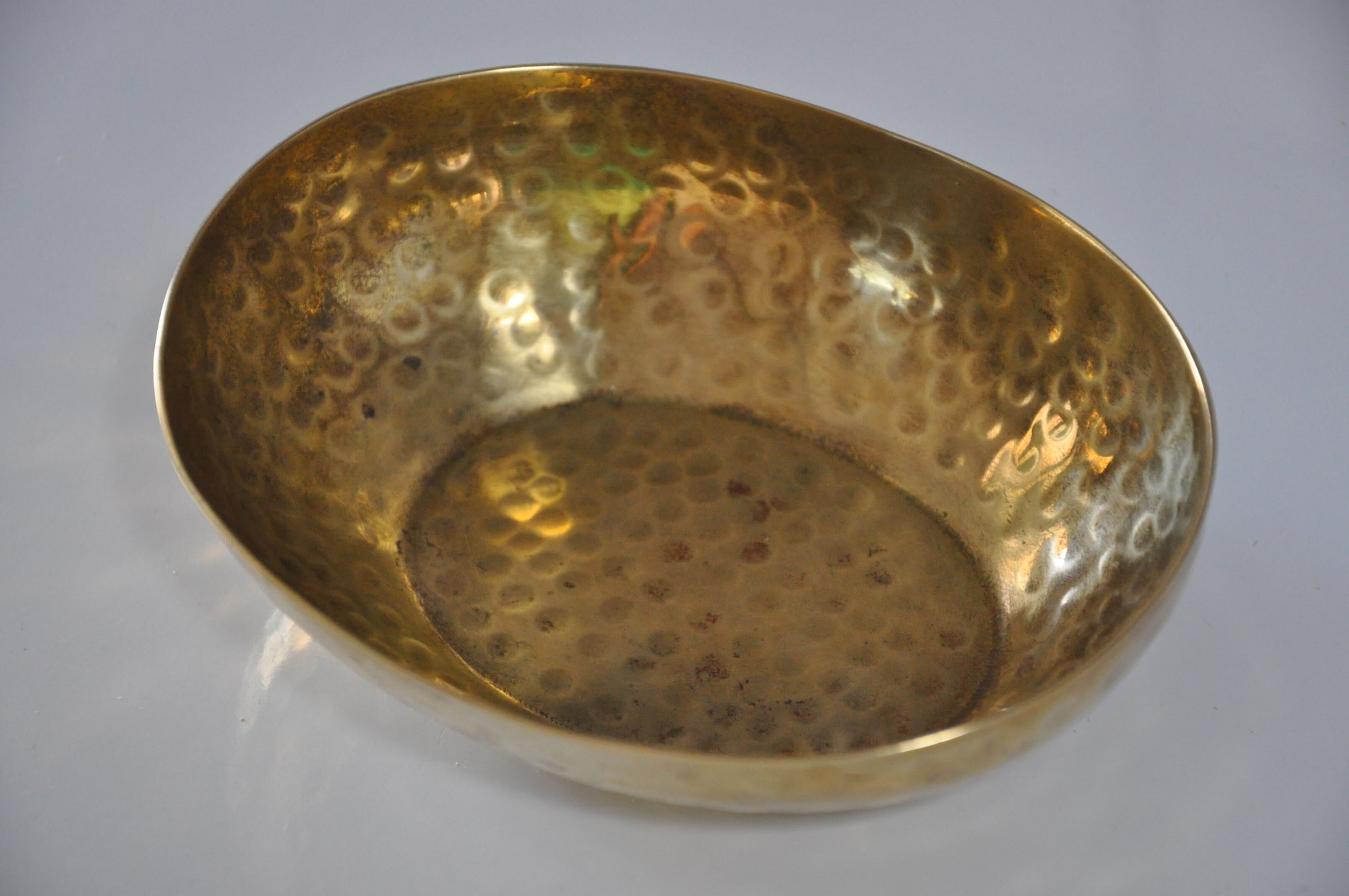 Empty hammered brass pocket