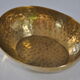 Empty hammered brass pocket