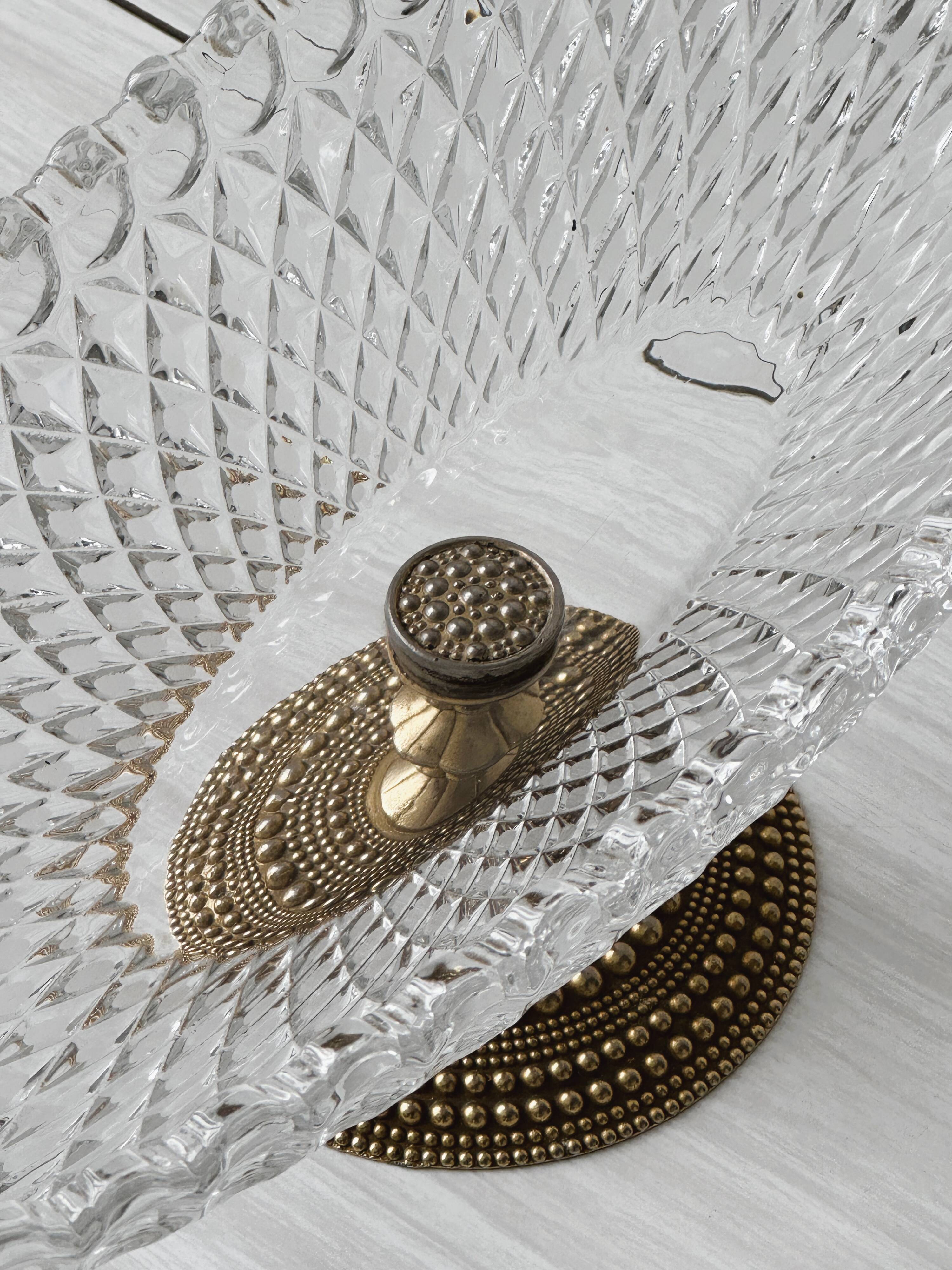 Molded glass bowl with gold metal base