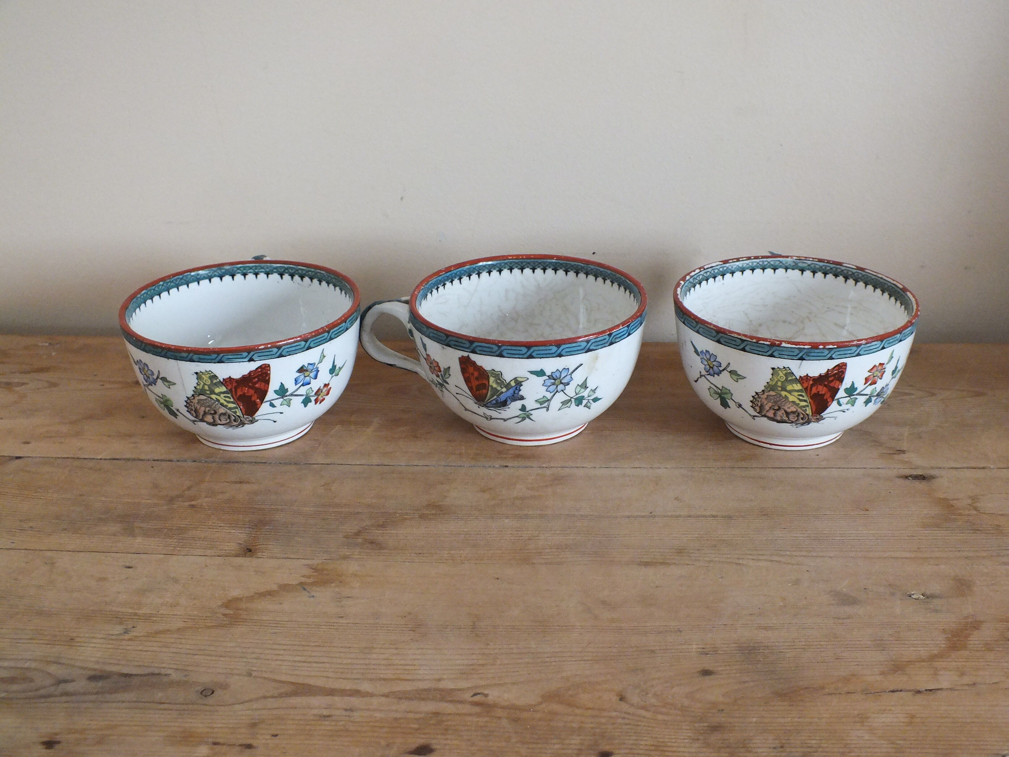 3 cups of English porcelain decorated with butterflies