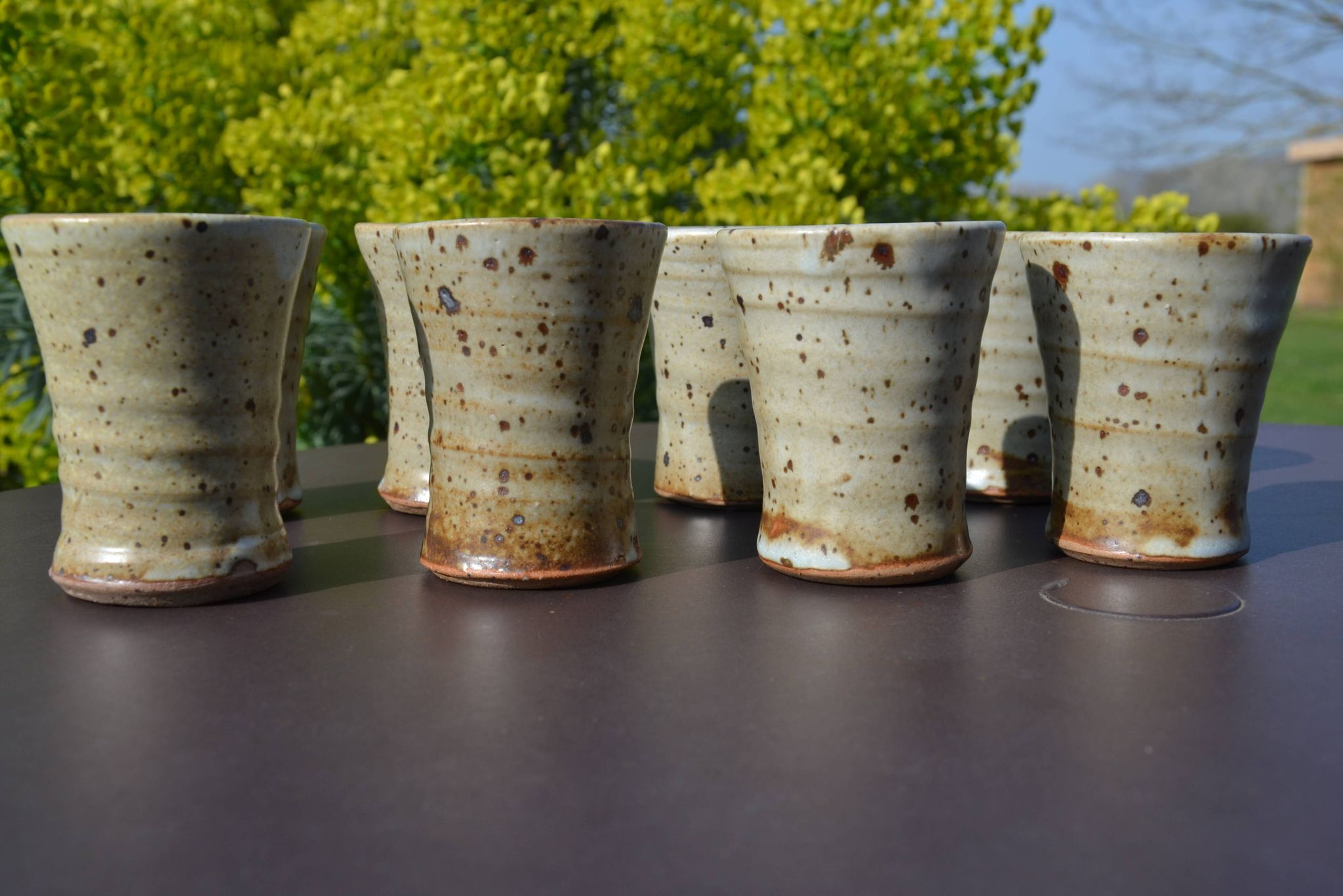 8 stoneware cups/mugs by Gustave Tiffoche