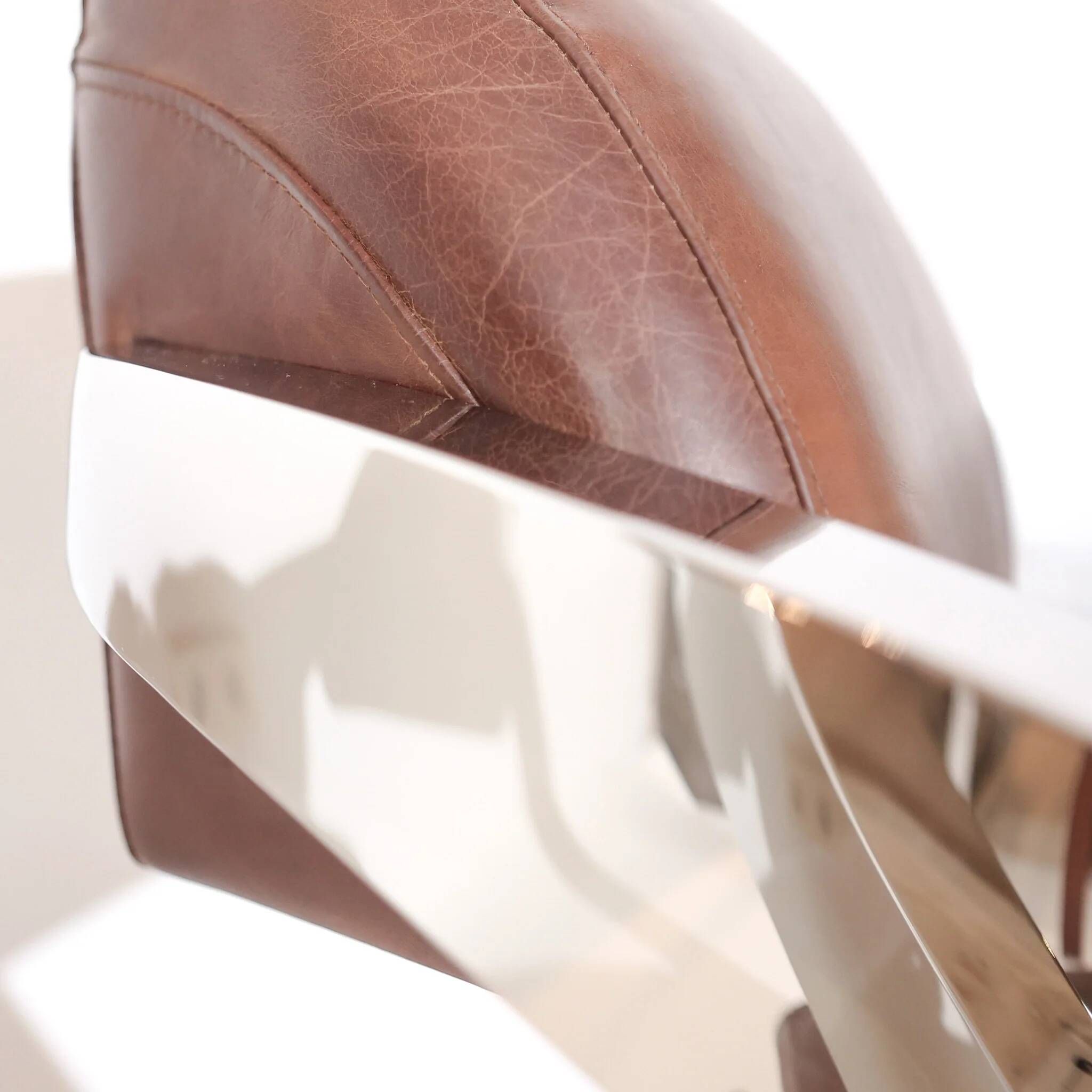 Pair of vintage lounge chairs Demon/Aviator in cognac leather and polished steel, Art Deco style.