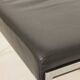 Pair of designer leather and brushed stainless steel footrests - Rob Parry