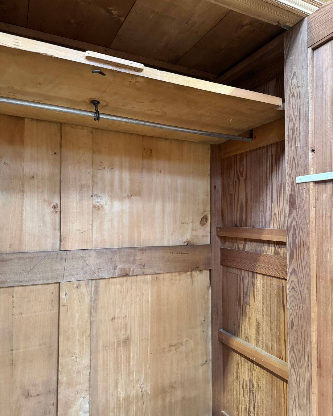 Small antique wardrobe in solid pitch pine.