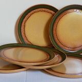 Six vintage stoneware plates with green net
