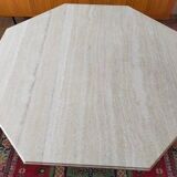 Octagonal dining table in travertine