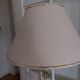 Vintage floor lamp with beige fabric shade and gold legs
