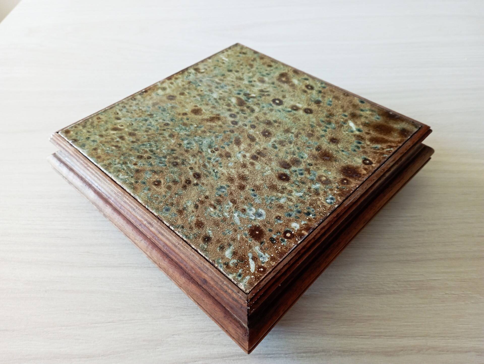 Old wood and ceramic trivet