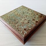 Old wood and ceramic trivet