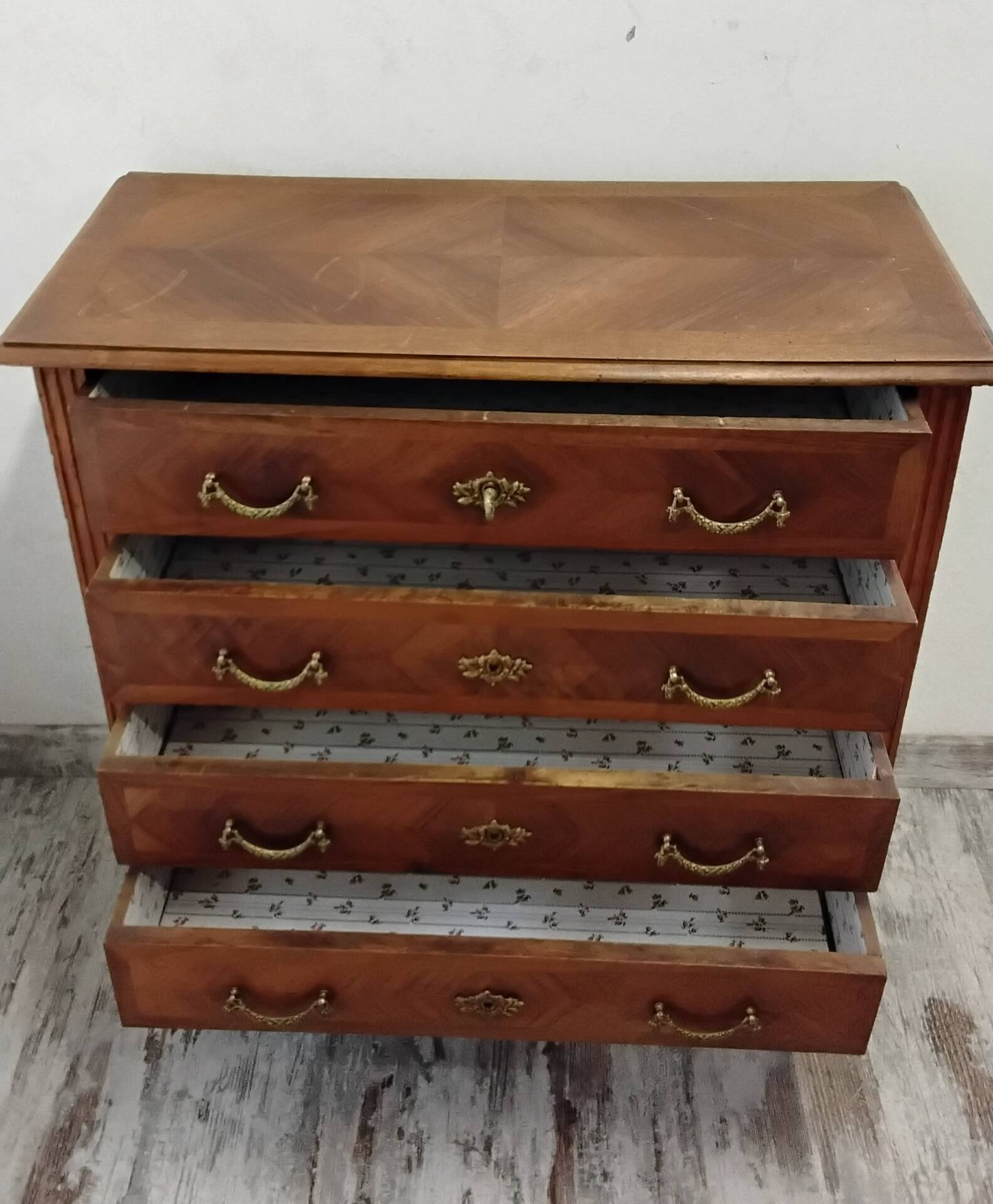 Antique marquetry commode in the Louis XVI style.