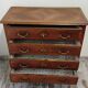 Antique marquetry commode in the Louis XVI style.